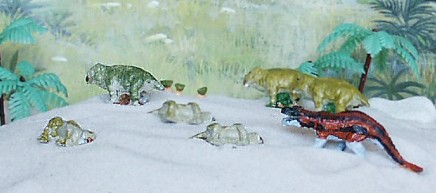 The QRF (Quick Reaction Force) Survive A Saurus Placerias carcass's and live Placerias. The Ral Partha figure most resembles Postosuchus. It has been referred to as Erythosuchus from the Early Triassic or Ticinosuchus from Middle Triassic. It was sold by Ral Partha labeled Small Carnosaurs 13-004 part of the Children of the Night along with Dimetrodon and Sphenacodon.