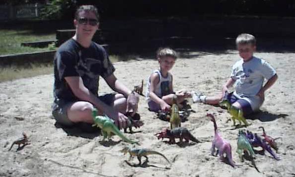 The Dinosaur Collector with his staff. The Dino Boyz with sand box dinosaurs. 